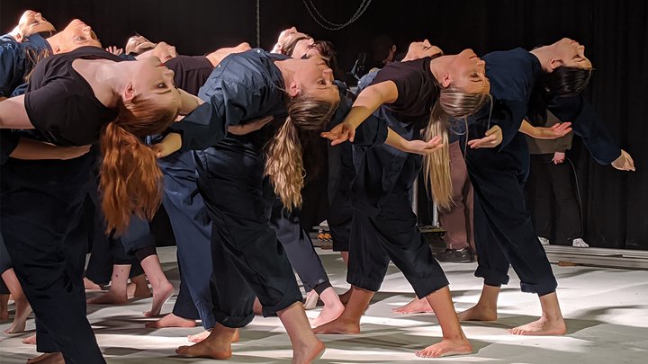 A group of dancers in the middle of a performance